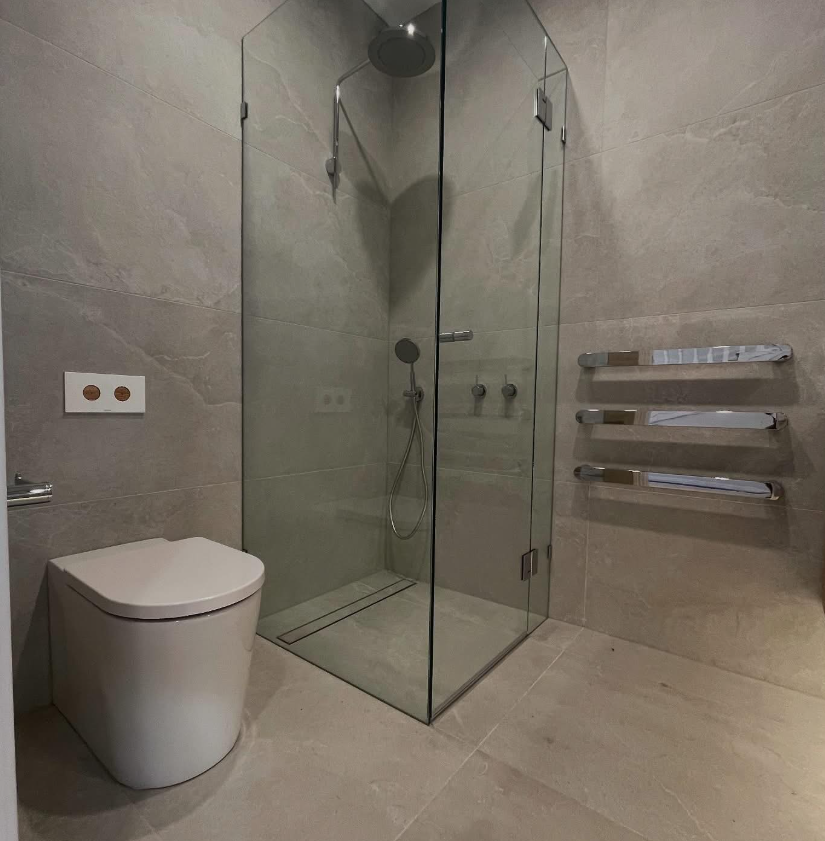 Minimalist bathroom with glass shower